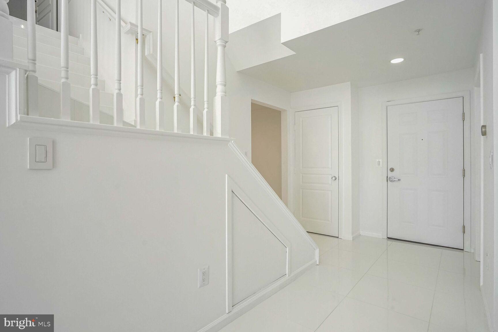 12000 Market Street, Unit 421 Reston, VA 20190 - Photo 6 of 64 Den, Entry, & Powder Bathroom to your right.