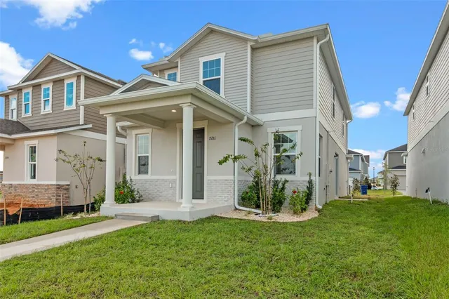 a view of a house with a yard