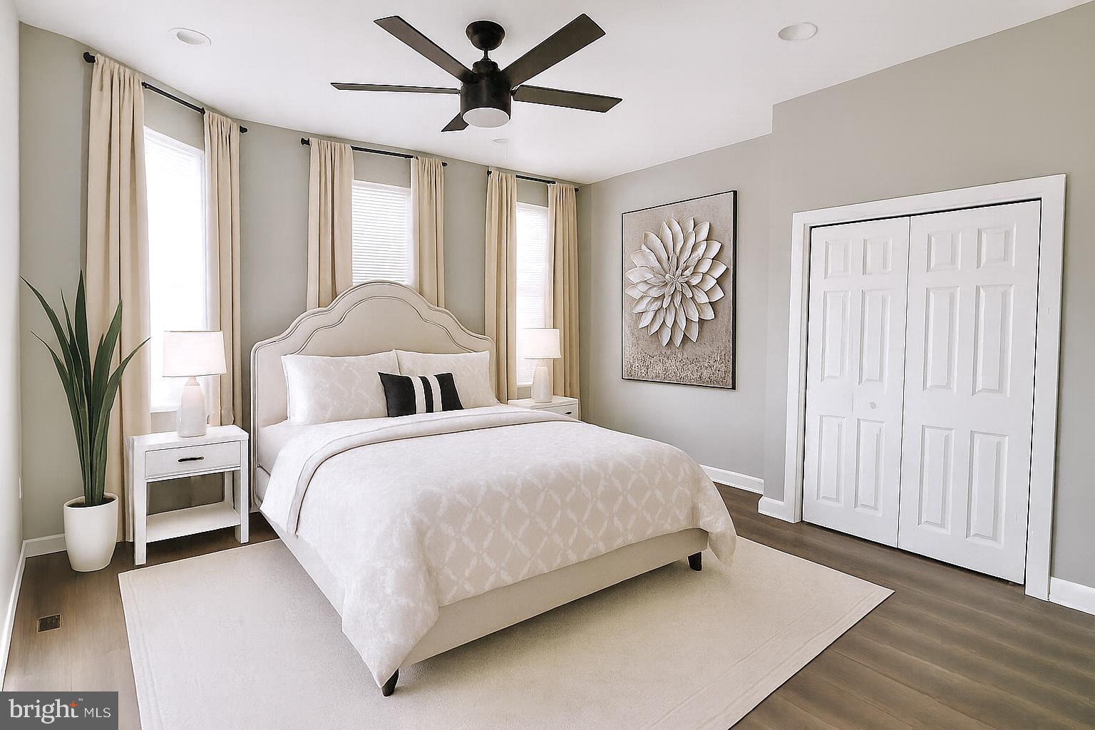 624 North Payson Street Baltimore, MD 21217 - Photo 3 of 8 a bedroom with a large bed and a chandelier