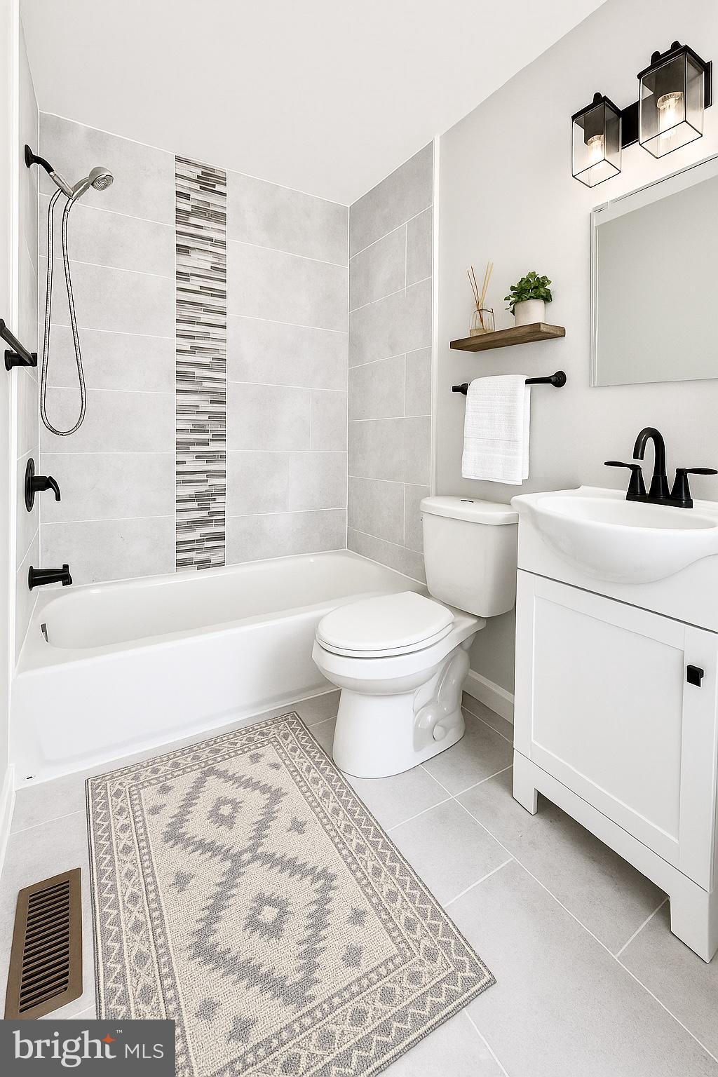 624 North Payson Street Baltimore, MD 21217 - Photo 4 of 8 a bathroom with a sink toilet and shower