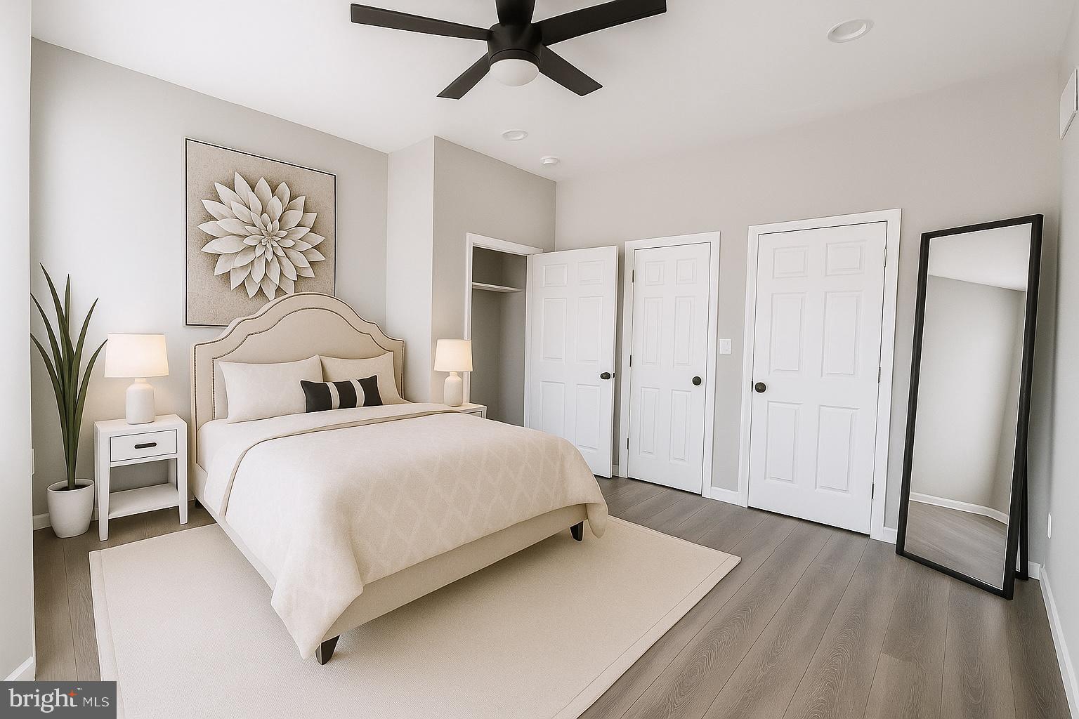 624 North Payson Street Baltimore, MD 21217 - Photo 5 of 8 a bedroom with a large bed and a chandelier