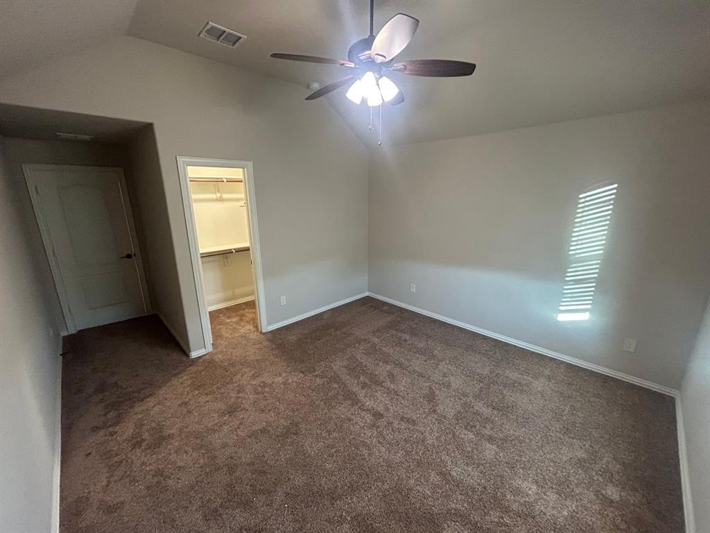 2003 Cheshire Way Forney, TX 75126 - Photo 20 of 35 an empty room with windows and fan