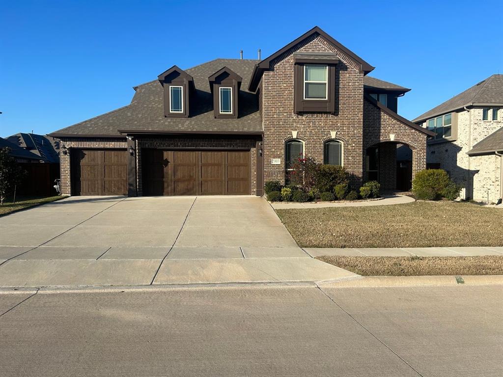 2003 Cheshire Way Forney, TX 75126 - Photo 2 of 35 a front view of a house with garage