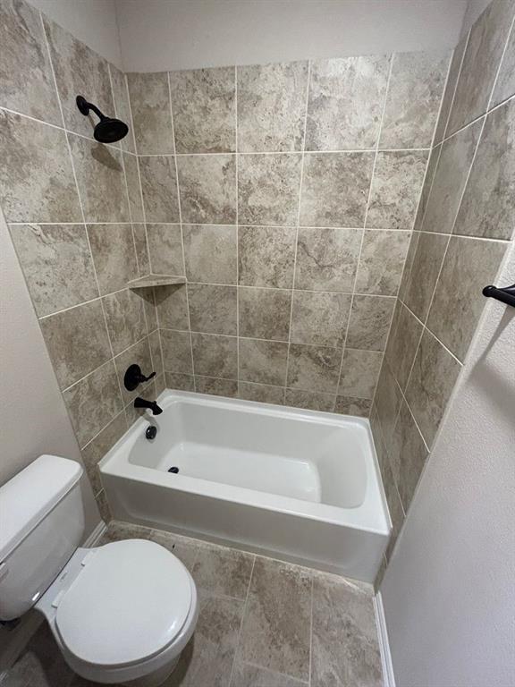 2003 Cheshire Way Forney, TX 75126 - Photo 23 of 35 a white toilet and tub sitting next to a bathroom sink