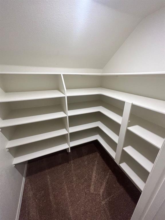 2003 Cheshire Way Forney, TX 75126 - Photo 24 of 35 a view of walk in closet with empty racks