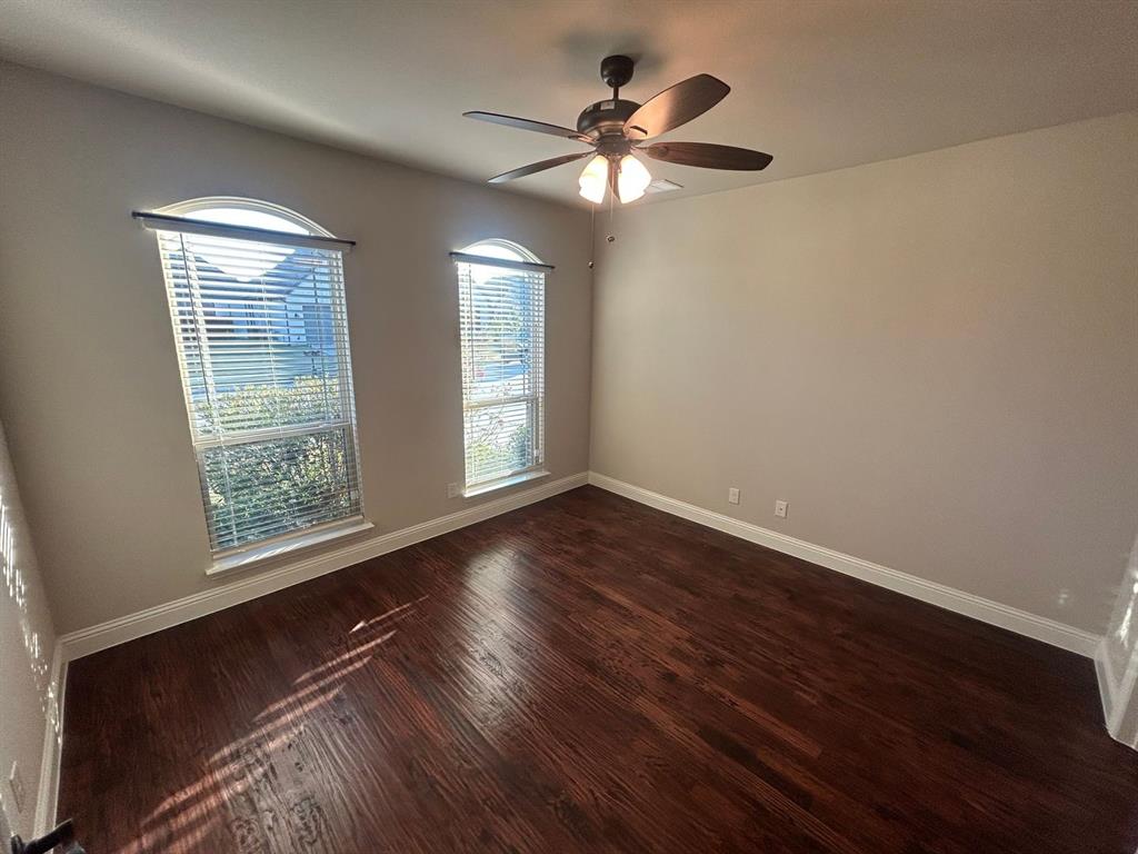 2003 Cheshire Way Forney, TX 75126 - Photo 3 of 35 a view of an empty room with wooden floor and a window