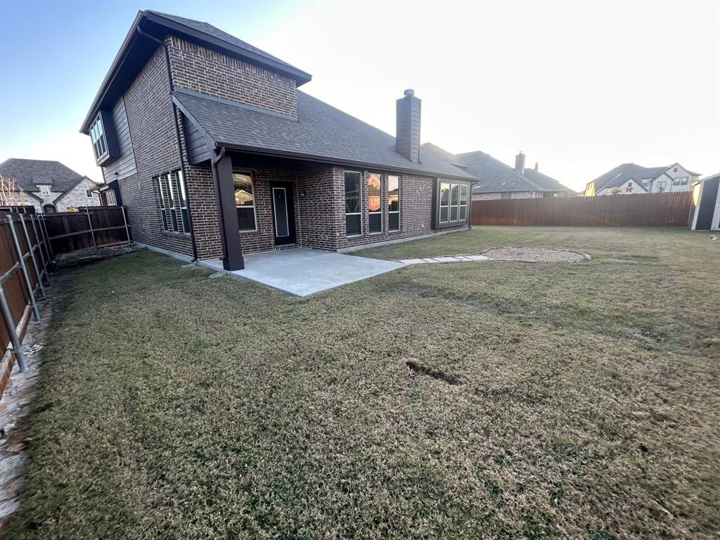 2003 Cheshire Way Forney, TX 75126 - Photo 34 of 35 a front view of a house with a yard