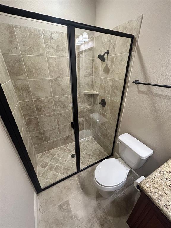 2003 Cheshire Way Forney, TX 75126 - Photo 7 of 35 a white toilet sitting next to a shower