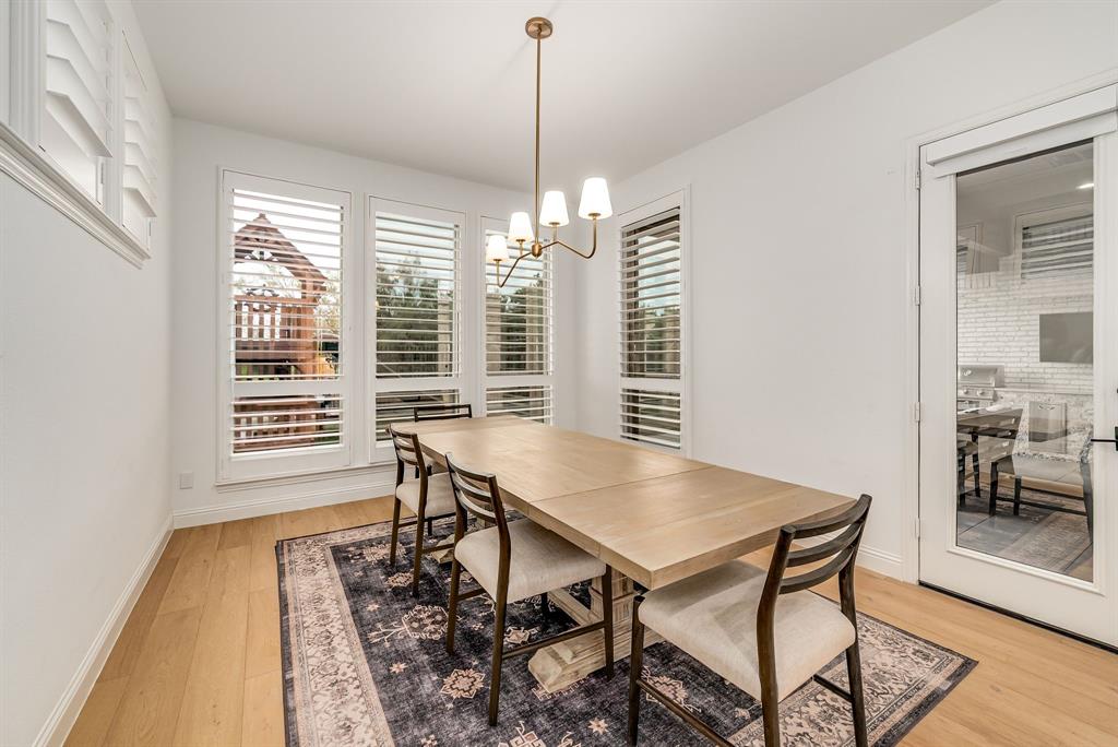 8288 Western The Colony, TX 75056 - Photo 11 of 40 a view of a dining room with furniture window and wooden floor