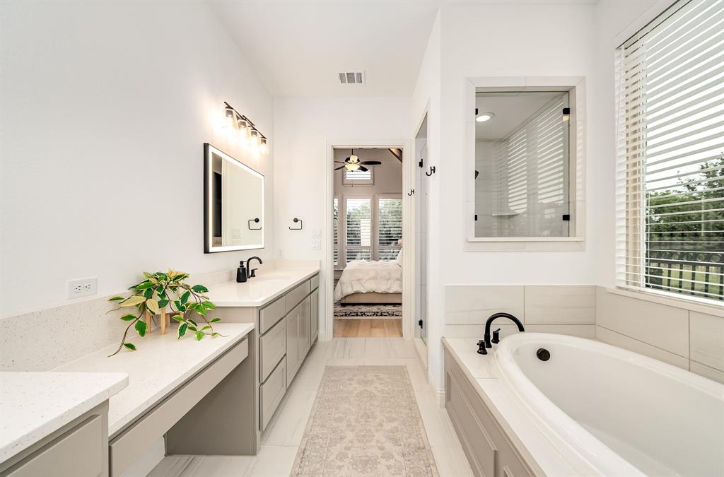 8288 Western The Colony, TX 75056 - Photo 15 of 40 a bathroom with a tub a sink and a bathtub