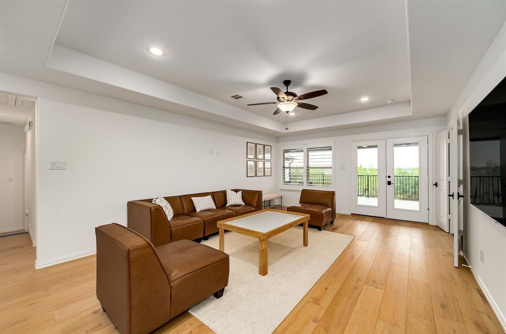 8288 Western The Colony, TX 75056 - Photo 19 of 40 a living room with furniture and a flat screen tv