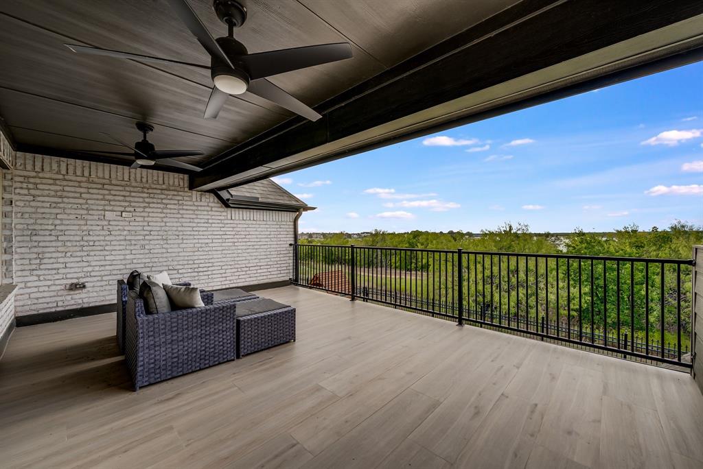 8288 Western The Colony, TX 75056 - Photo 22 of 40 a view of roof deck with couches and wooden floor