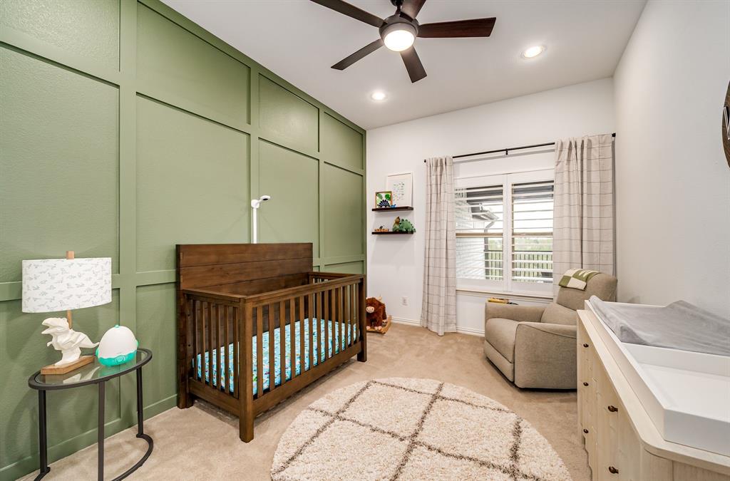 8288 Western The Colony, TX 75056 - Photo 26 of 40 a bedroom with a bed and a window