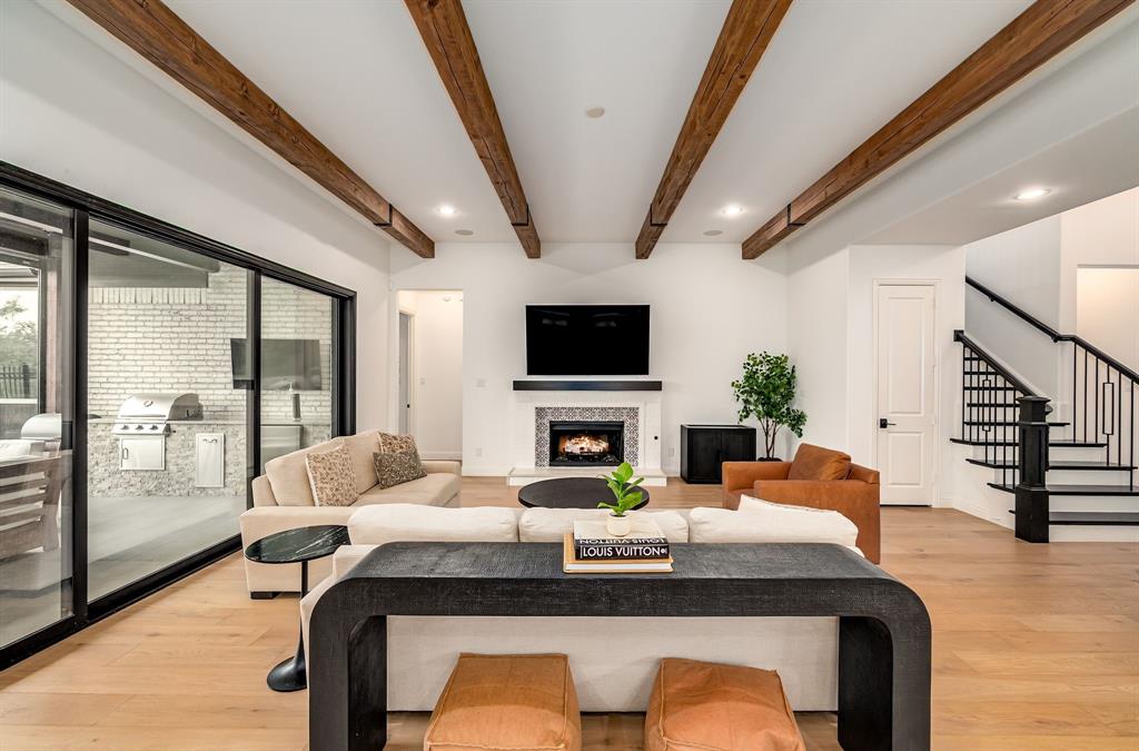 8288 Western The Colony, TX 75056 - Photo 7 of 40 a living room with fireplace furniture and a flat screen tv