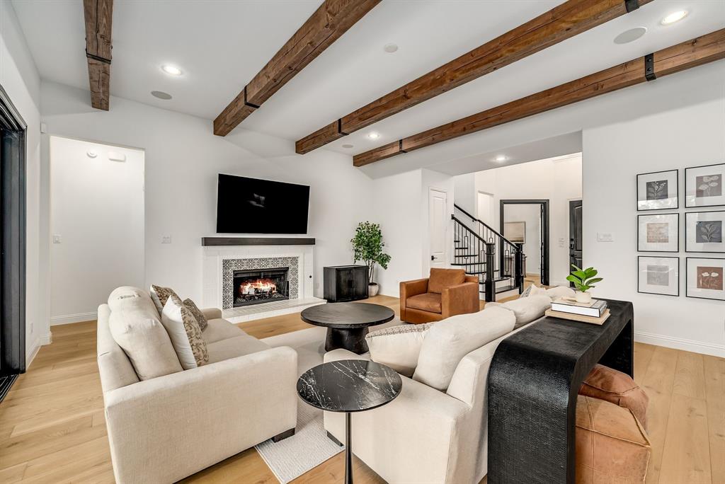 8288 Western The Colony, TX 75056 - Photo 8 of 40 a living room with fireplace furniture and a flat screen tv