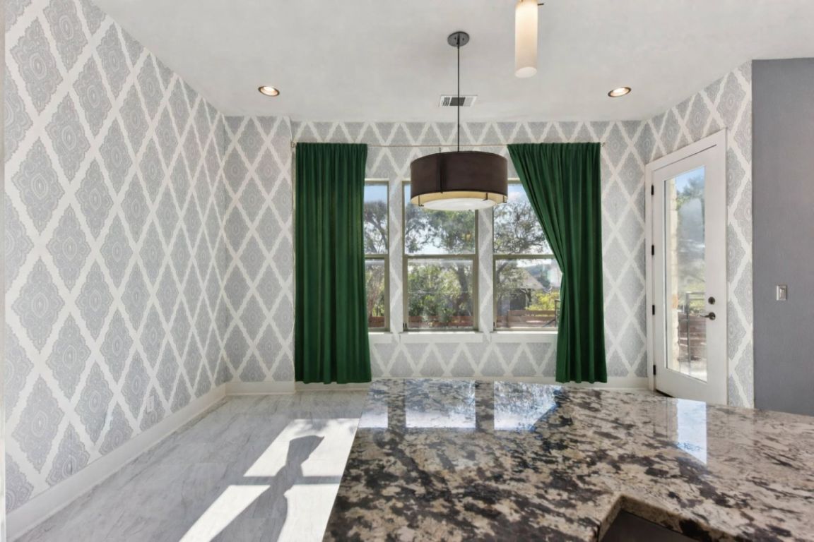 8110 Ranch Road 2222, Unit 98 Austin, TX 78730 - Photo 13 of 37 Dining area featuring wallpapered walls and recessed lighting