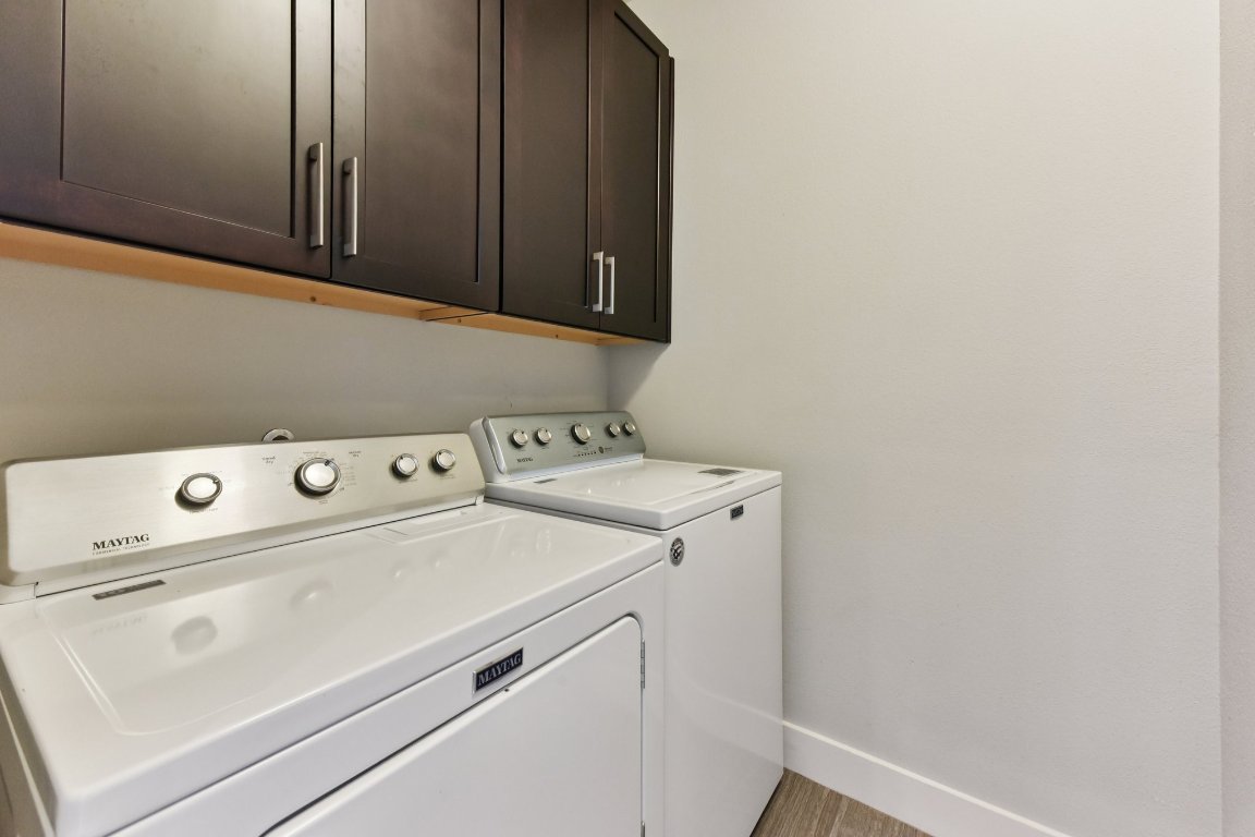 8110 Ranch Road 2222, Unit 98 Austin, TX 78730 - Photo 15 of 37 Washroom with cabinet space and separate washer and dryer