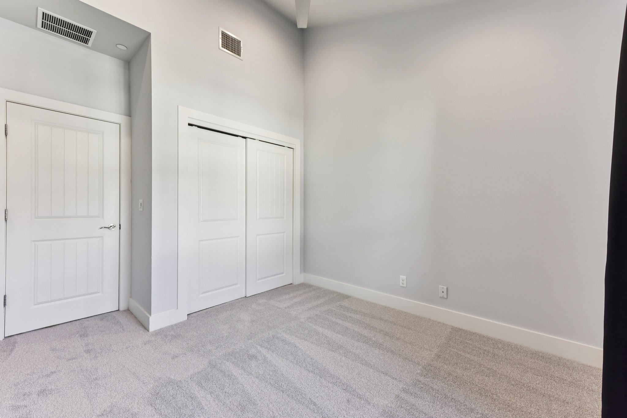8110 Ranch Road 2222, Unit 98 Austin, TX 78730 - Photo 24 of 37 Unfurnished bedroom featuring light carpet and a closet