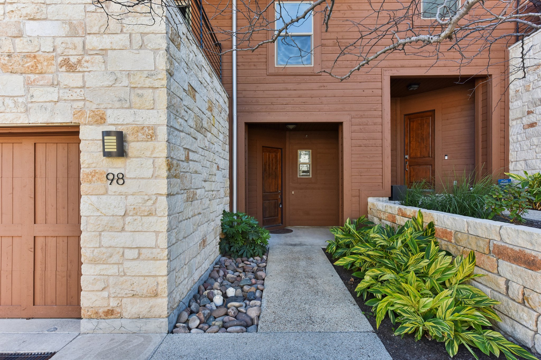 8110 Ranch Road 2222, Unit 98 Austin, TX 78730 - Photo 2 of 37 Doorway to property with stone siding