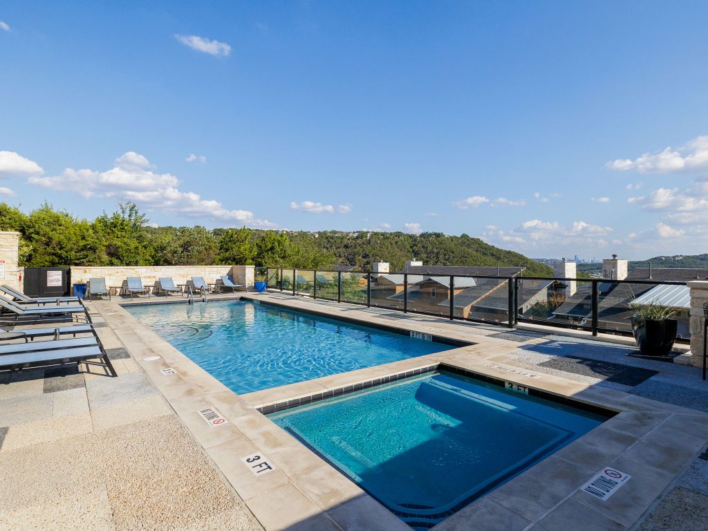 8110 Ranch Road 2222, Unit 98 Austin, TX 78730 - Photo 36 of 37 Community pool featuring a hot tub and a patio area