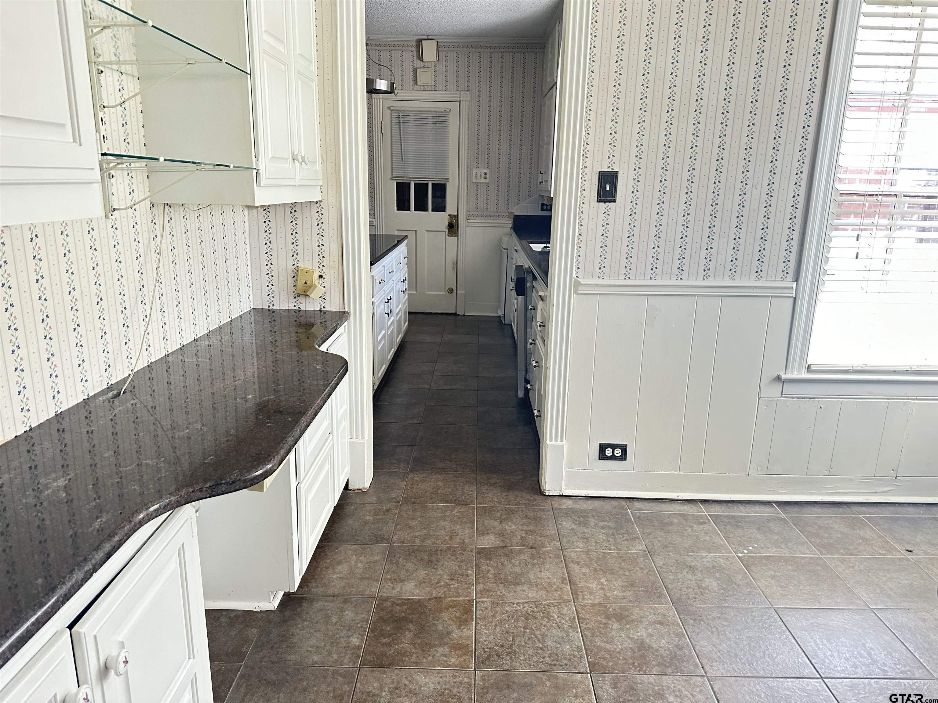 2337 East Rusk Street Jacksonville, TX 75766 - Photo 16 of 47 a view of entry way with wooden door