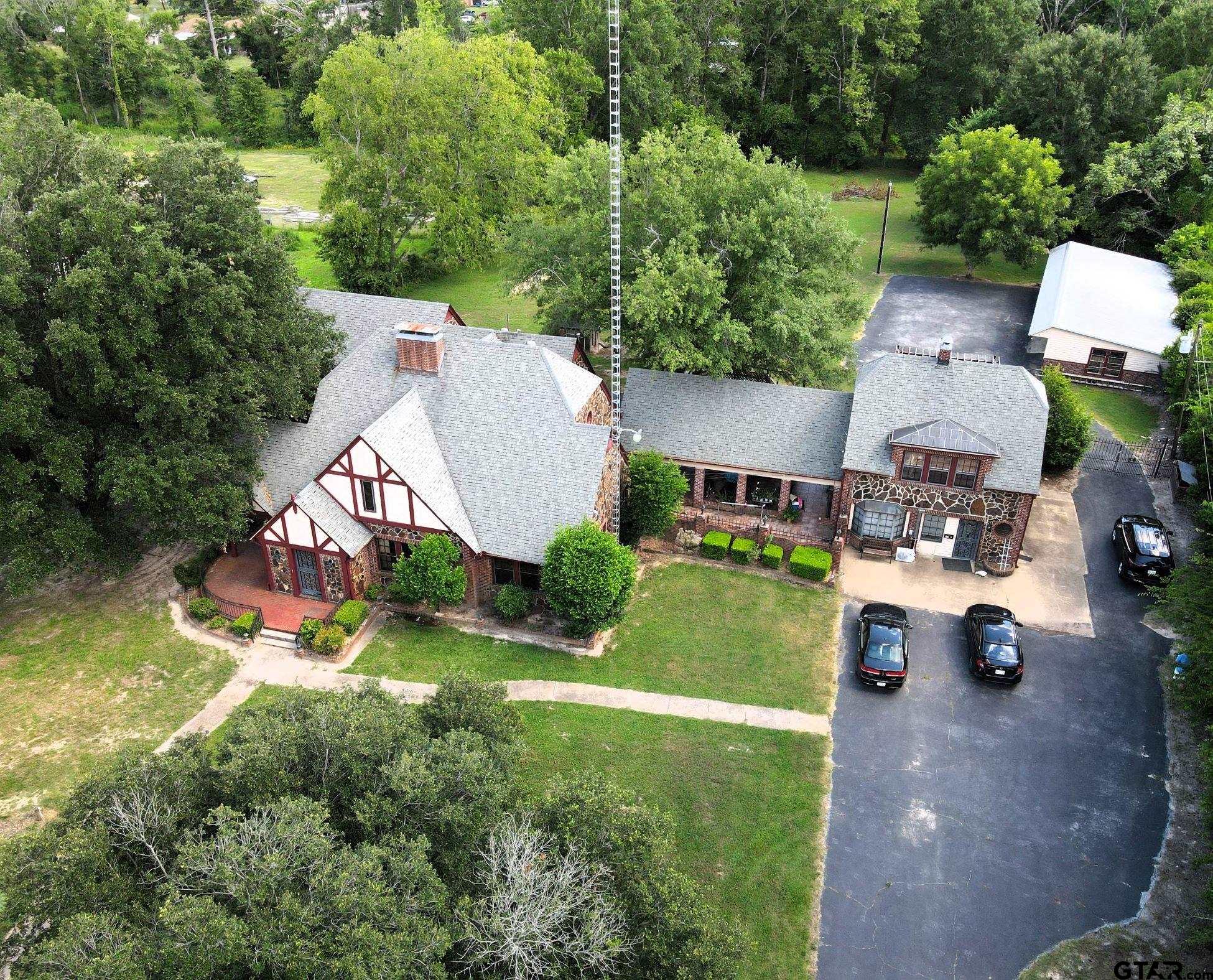 2337 East Rusk Street Jacksonville, TX 75766 - Photo 3 of 47 an aerial view of a house with yard swimming pool and outdoor seating