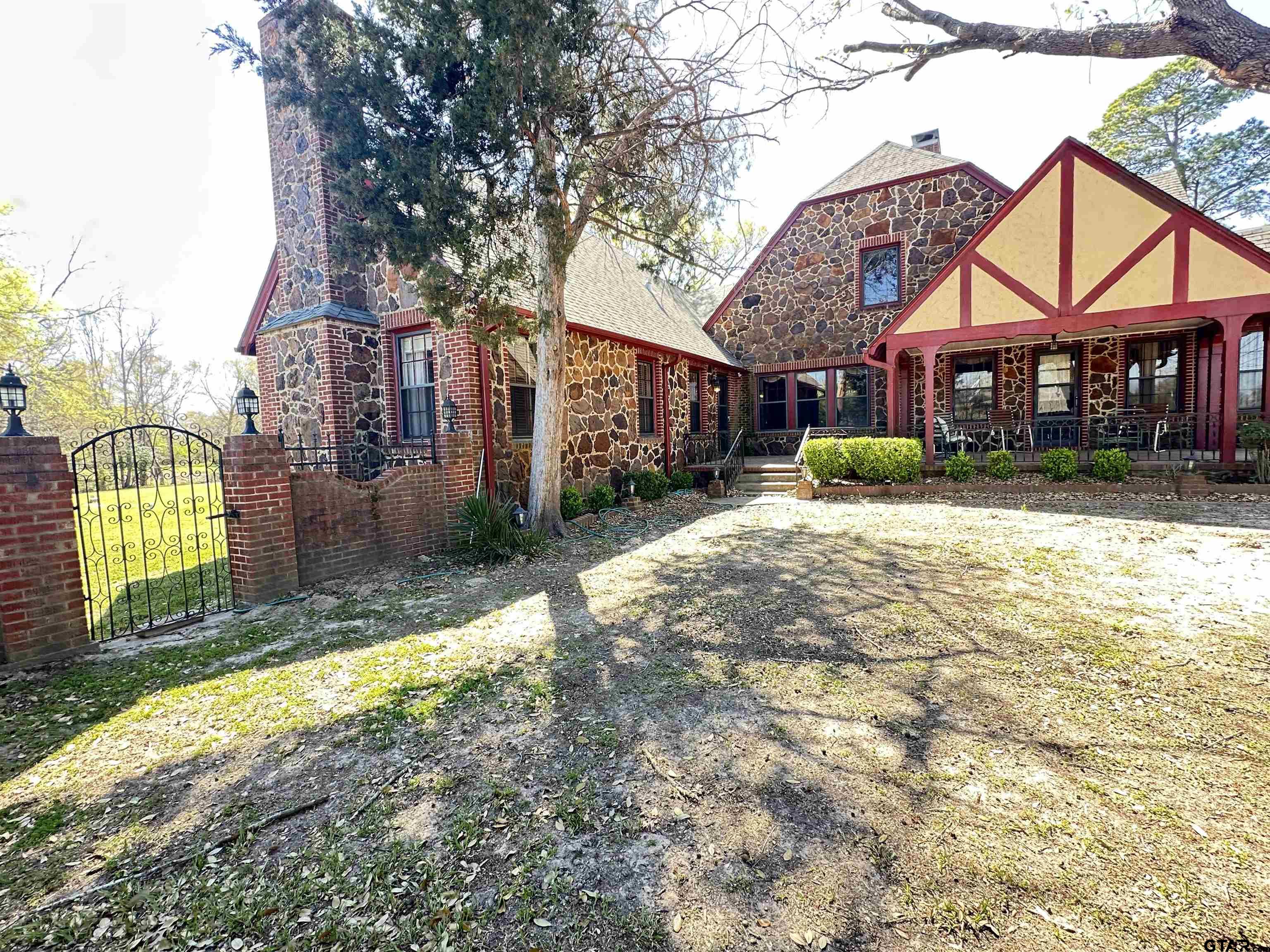 2337 East Rusk Street Jacksonville, TX 75766 - Photo 36 of 47 a view of a house with a yard and pathway