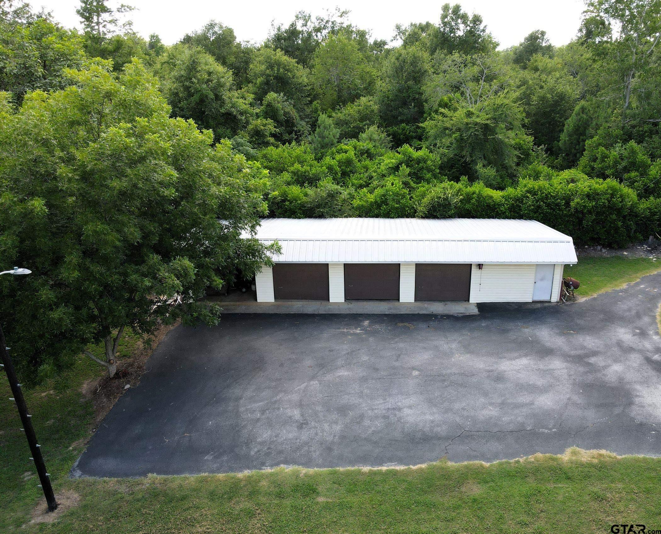 2337 East Rusk Street Jacksonville, TX 75766 - Photo 37 of 47 a view of a house with a yard