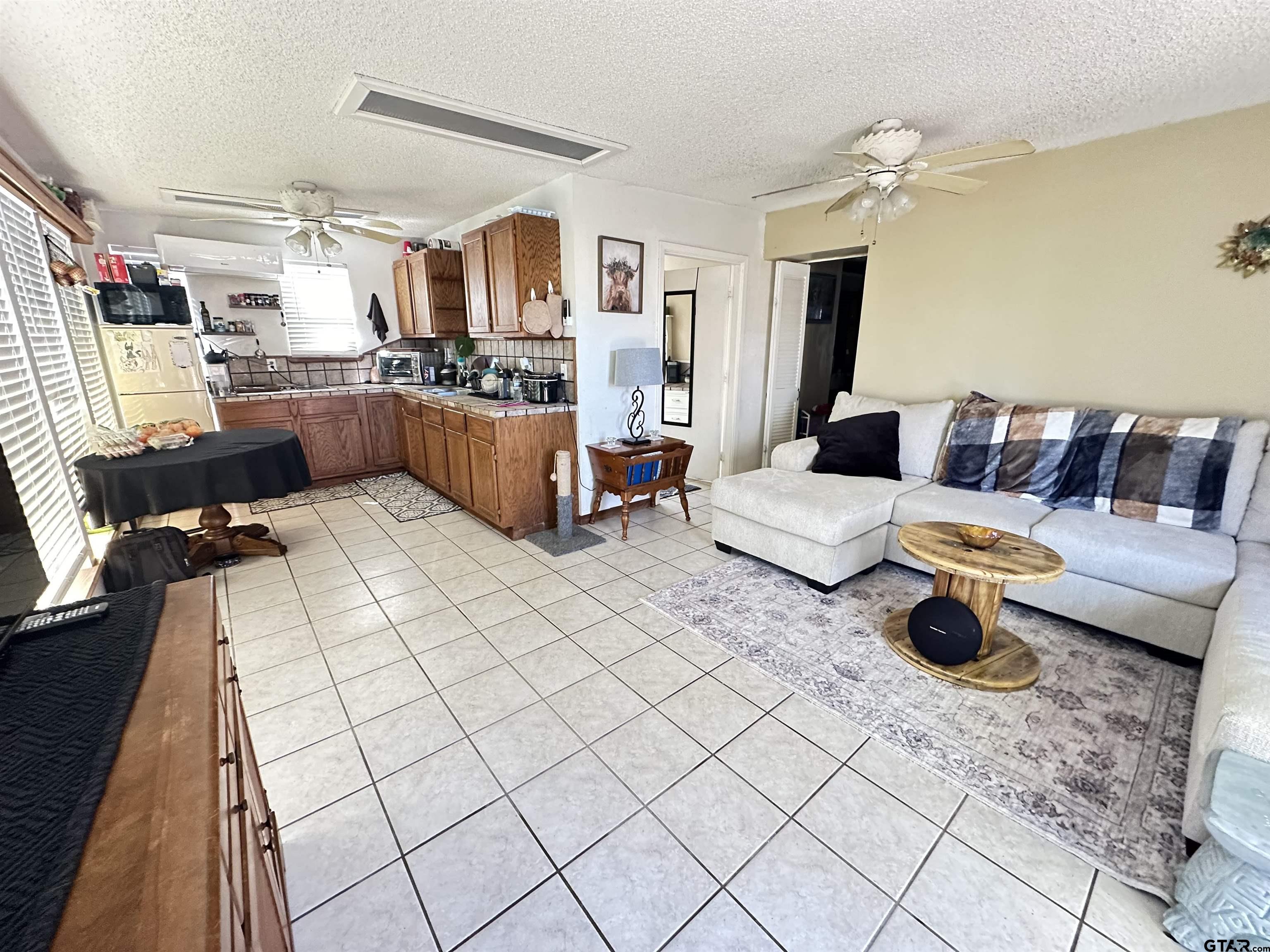 2337 East Rusk Street Jacksonville, TX 75766 - Photo 39 of 47 a living room with furniture and a couch