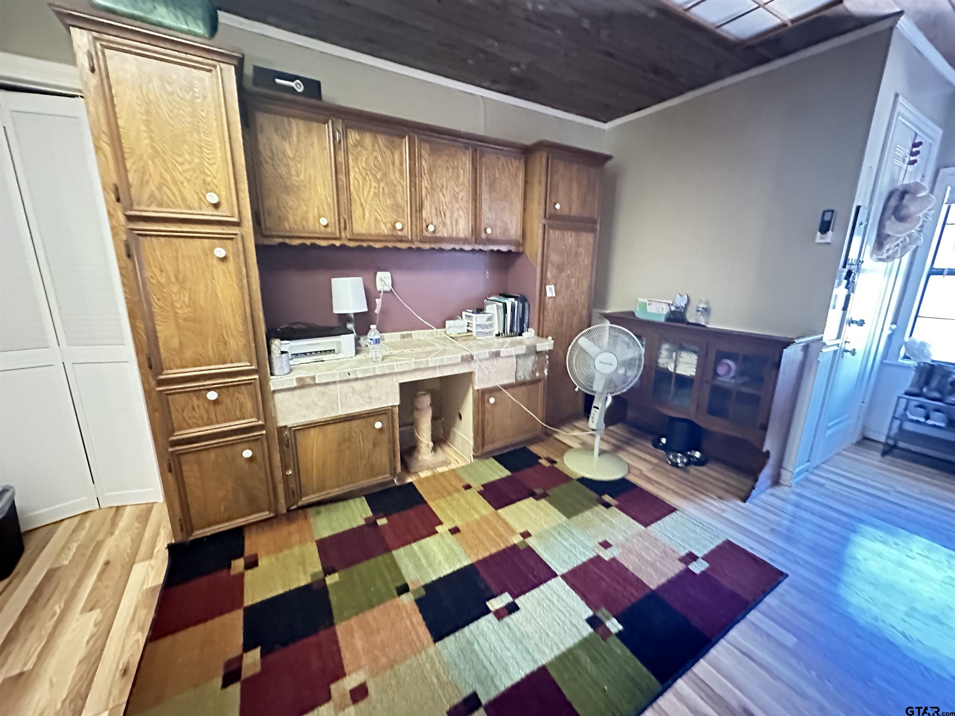 2337 East Rusk Street Jacksonville, TX 75766 - Photo 41 of 47 a living room with a black white checkered floor with furniture and a fireplace