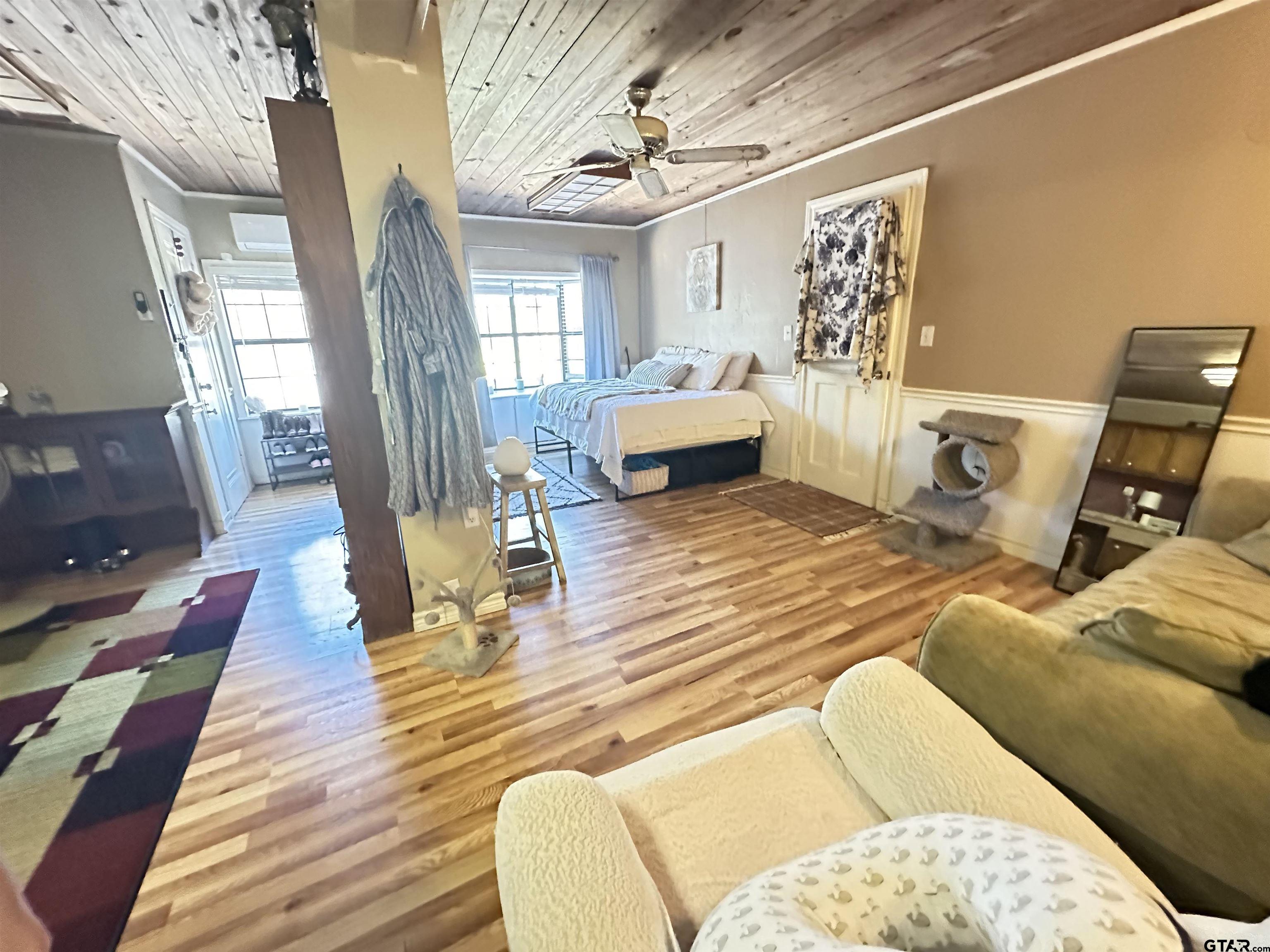 2337 East Rusk Street Jacksonville, TX 75766 - Photo 42 of 47 a bedroom with furniture and a wooden floor