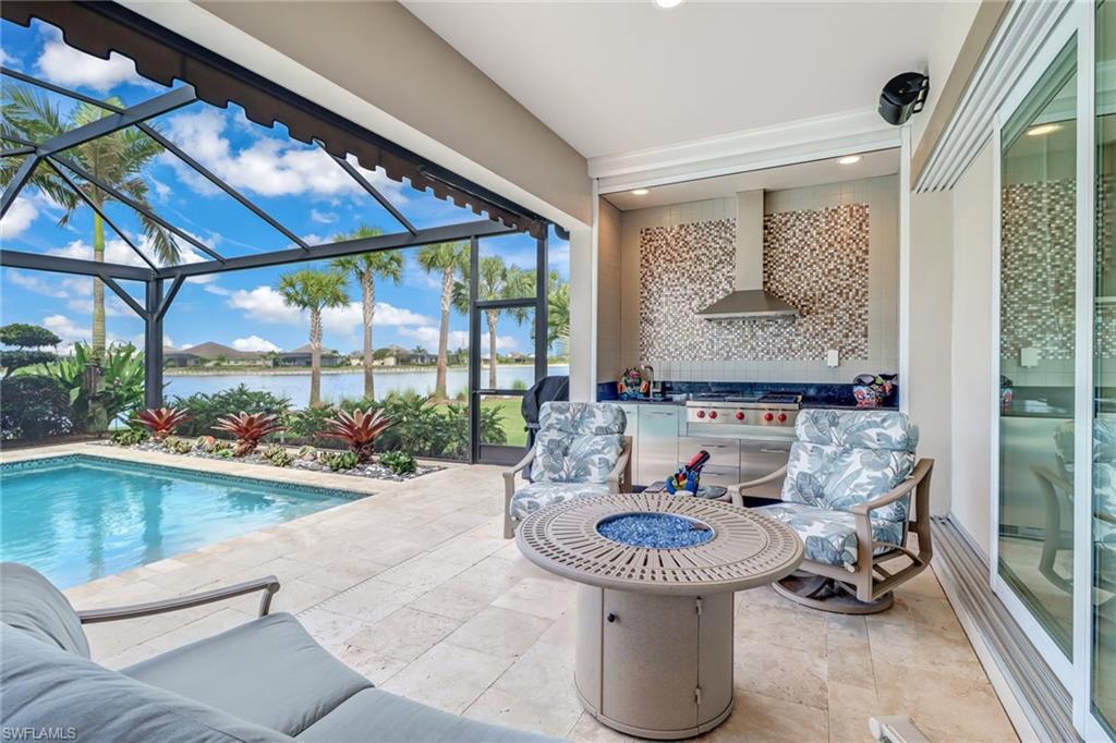 6487 Warwick Avenue Naples, FL 34113 - Photo 24 of 32 a room with furniture and a large window