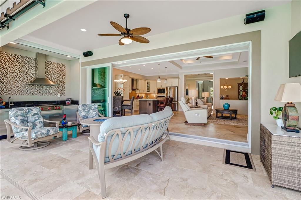 6487 Warwick Avenue Naples, FL 34113 - Photo 26 of 32 a living room with furniture and a large window