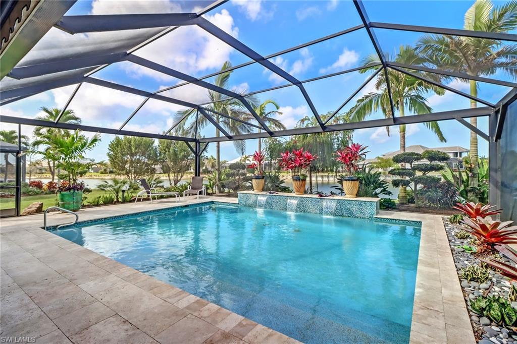 6487 Warwick Avenue Naples, FL 34113 - Photo 28 of 32 a view of a swimming pool with a yard