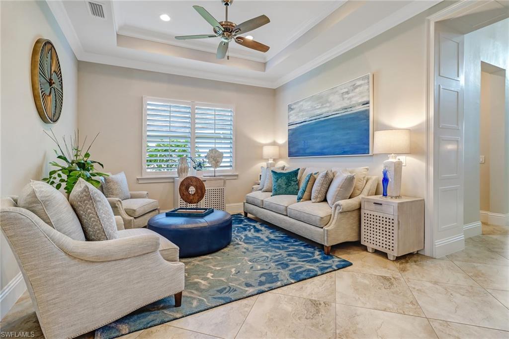 6487 Warwick Avenue Naples, FL 34113 - Photo 6 of 32 a living room with furniture and a large window