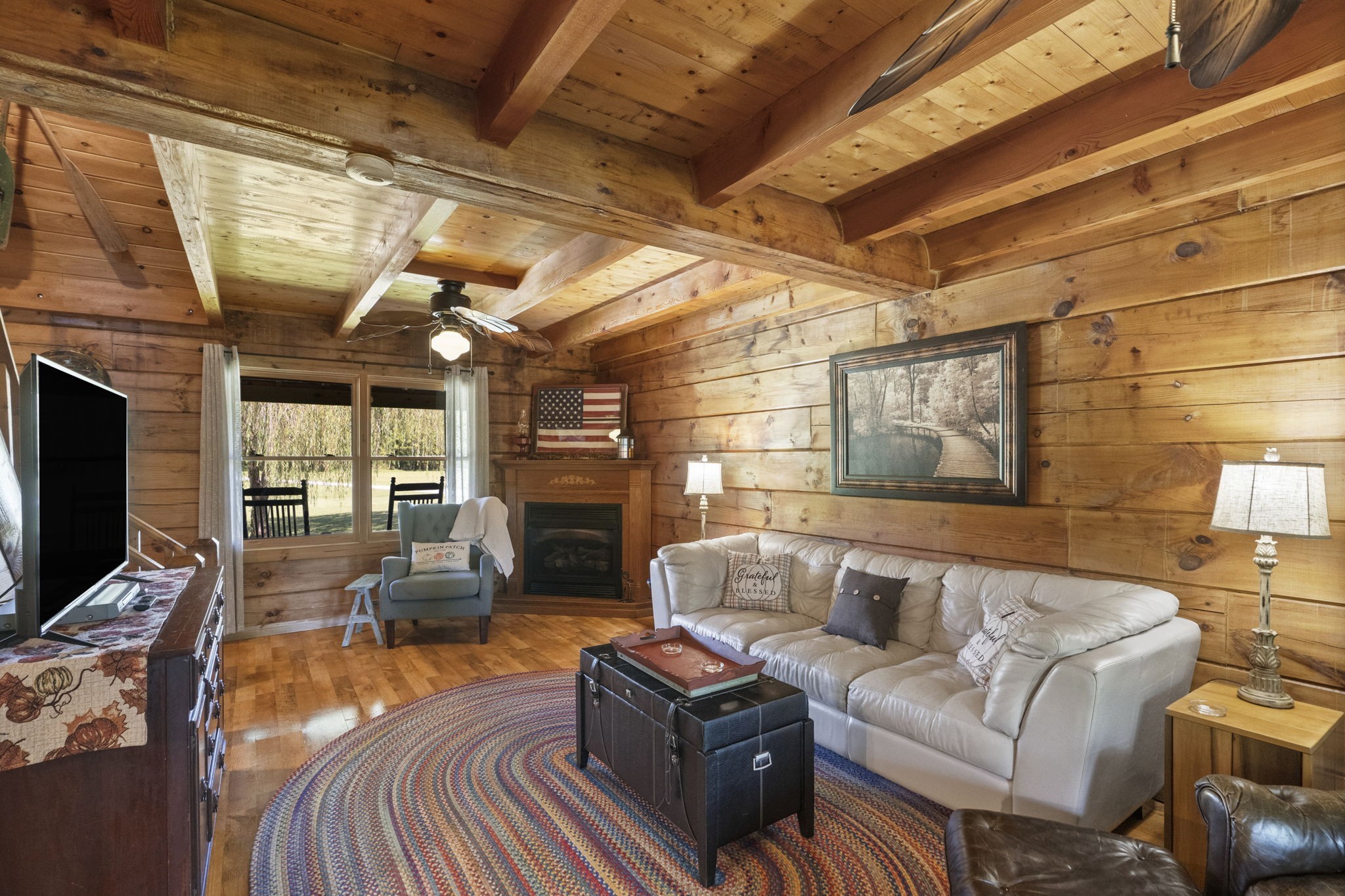 546 Hiwassee Road Lebanon, TN 37087 - Photo 29 of 67 a living room with furniture a flat screen tv and a fireplace