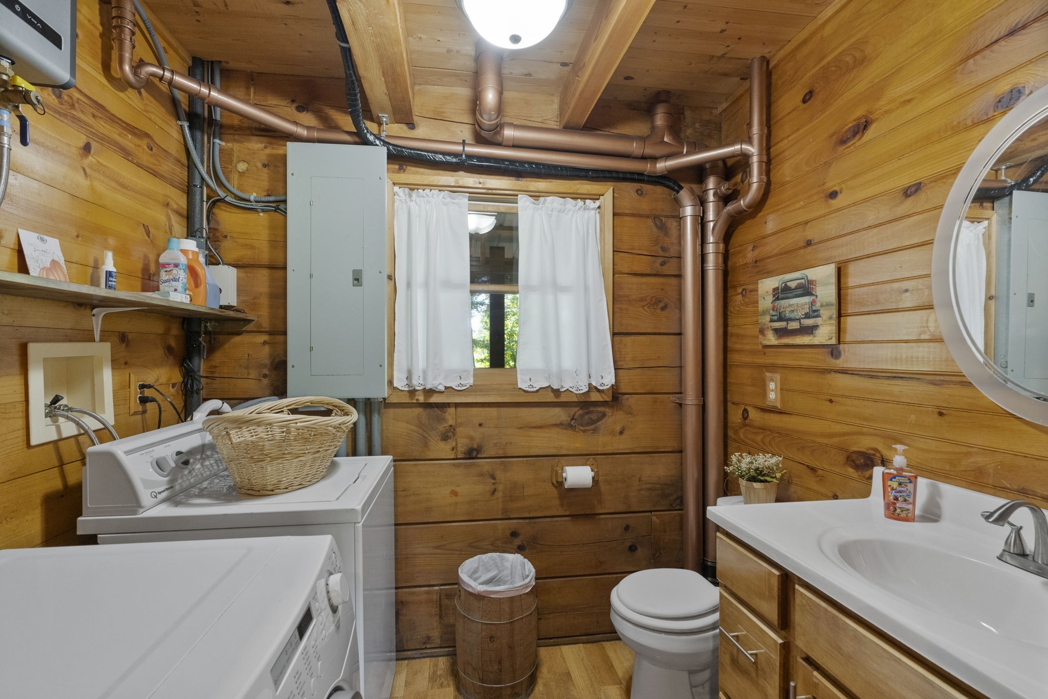 546 Hiwassee Road Lebanon, TN 37087 - Photo 48 of 67 a bathroom with a sink toilet mirror vanity and shower