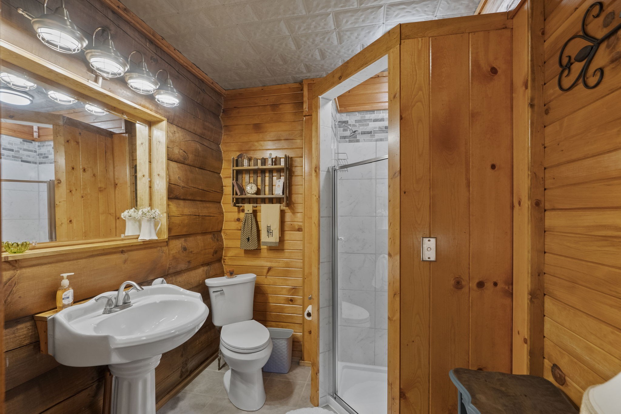 546 Hiwassee Road Lebanon, TN 37087 - Photo 49 of 67 a bathroom with a sink toilet and shower