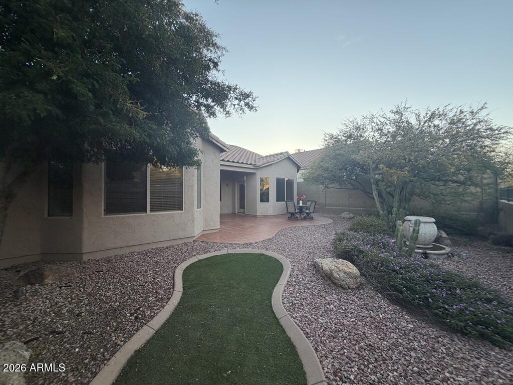 3330 West Ravina Lane Anthem, AZ 85086 - Photo 15 of 29 a front view of a house with garden