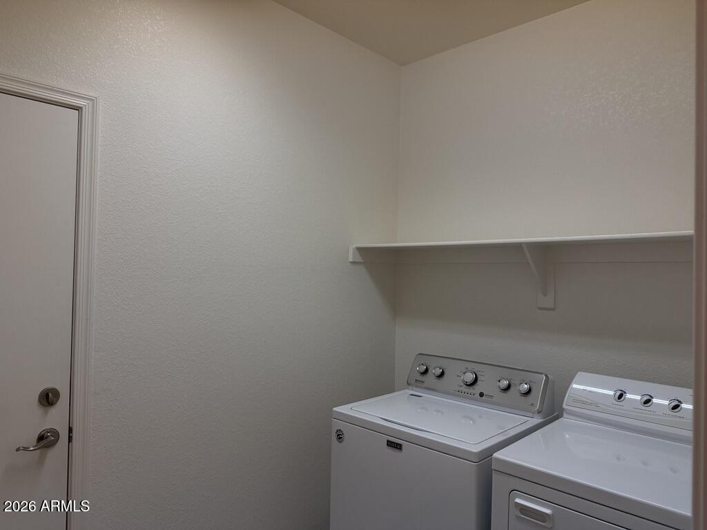 3330 West Ravina Lane Anthem, AZ 85086 - Photo 19 of 29 a utility room with dryer and washer