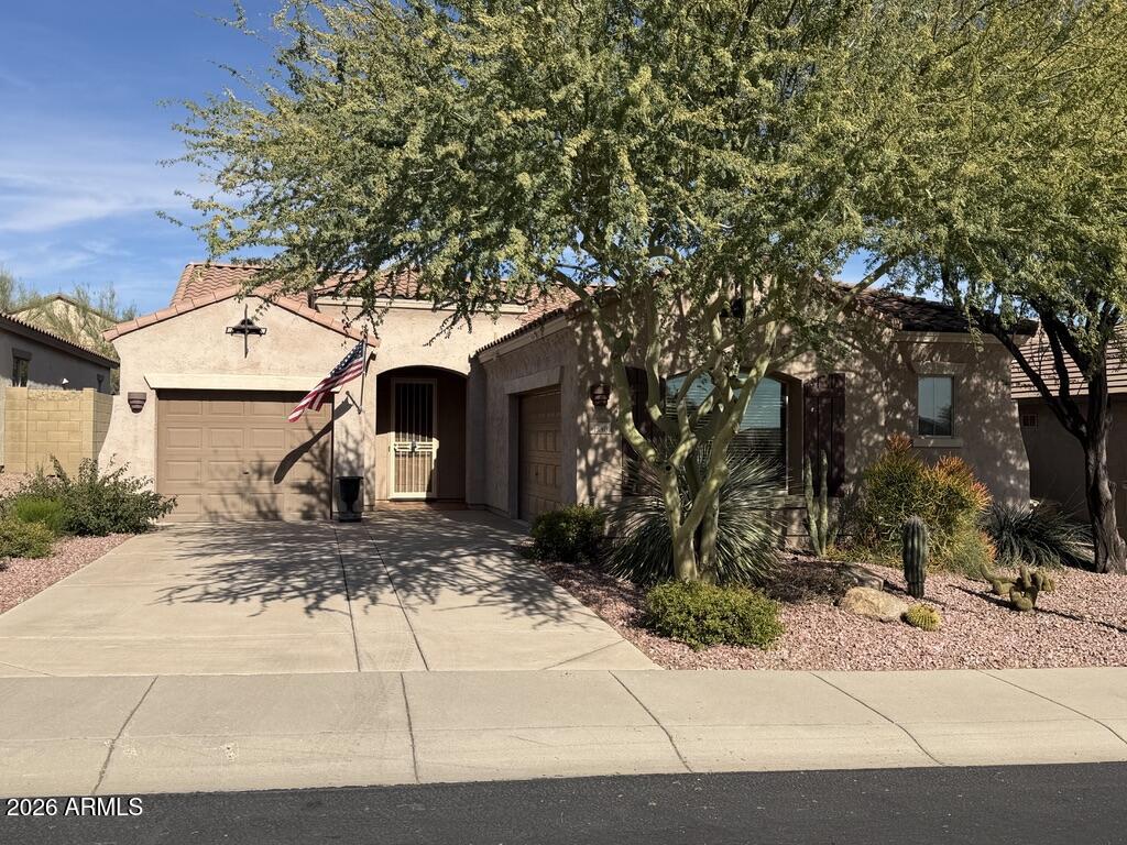3330 West Ravina Lane Anthem, AZ 85086 - Photo 2 of 29 a front view of a house with a yard