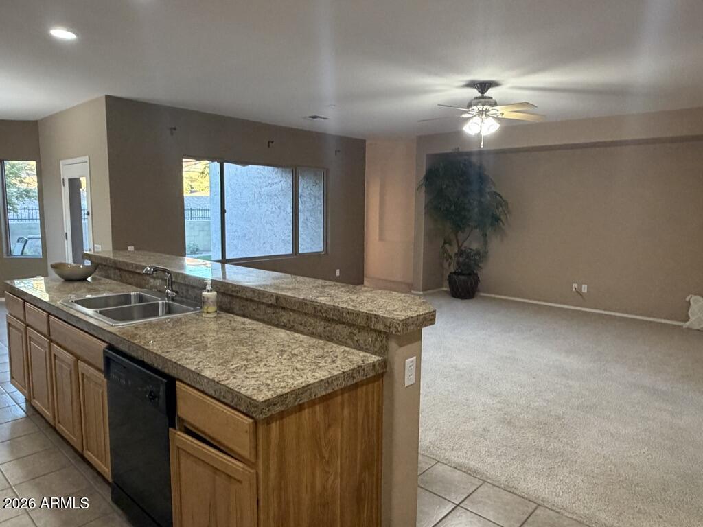 3330 West Ravina Lane Anthem, AZ 85086 - Photo 4 of 29 a kitchen with a stove and a sink