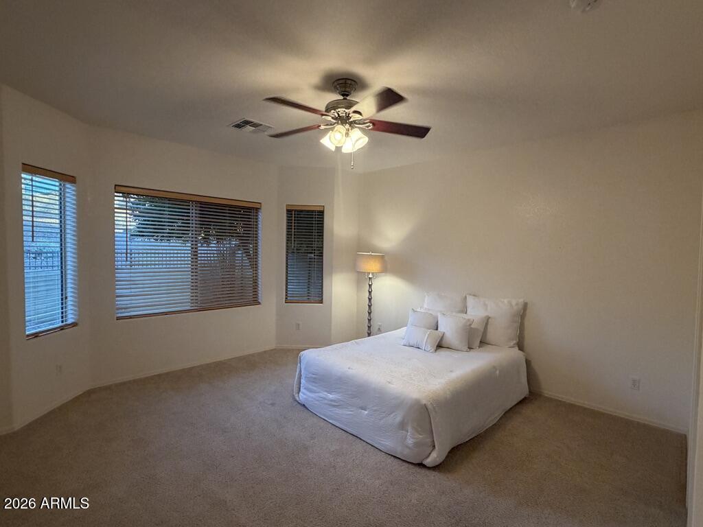 3330 West Ravina Lane Anthem, AZ 85086 - Photo 8 of 29 a bedroom with a bed and window