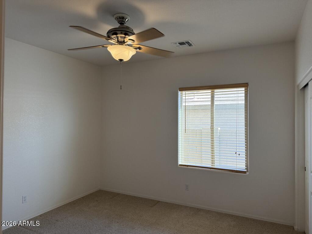 3330 West Ravina Lane Anthem, AZ 85086 - Photo 10 of 29 an empty room with a window