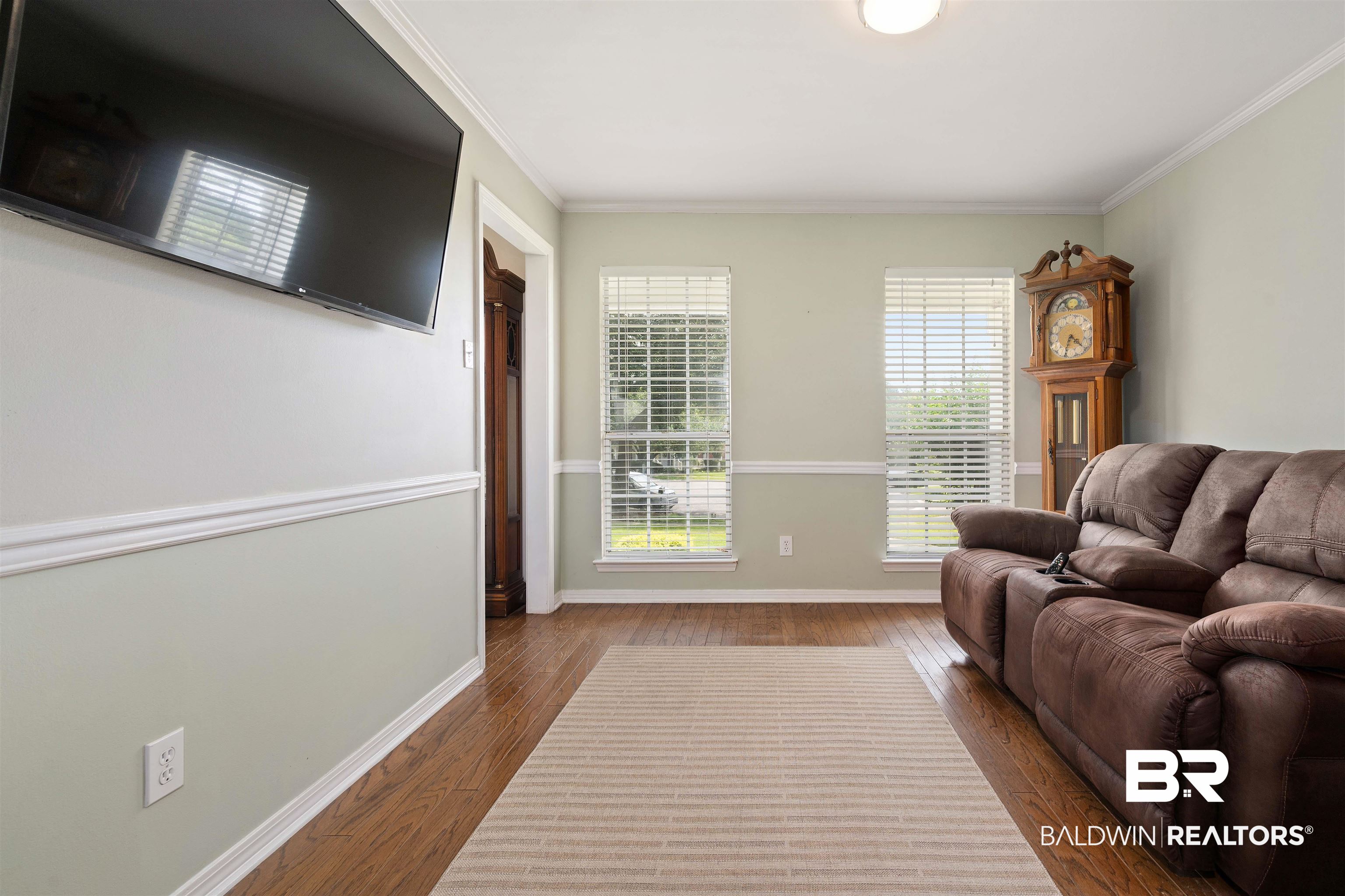 6457 Double Tree Court Mobile, AL 36695 - Photo 17 of 37 Living room with ornamental molding and hardwood / wood-style flooring