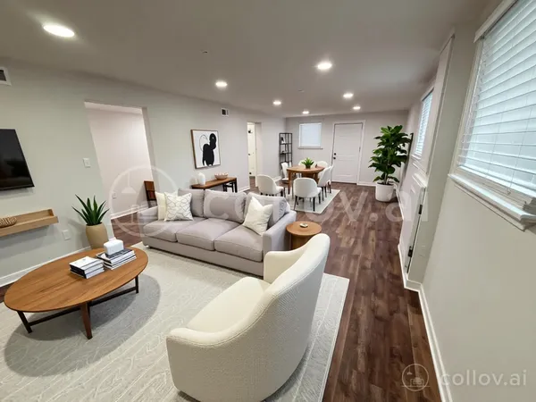 a living room with furniture and a rug