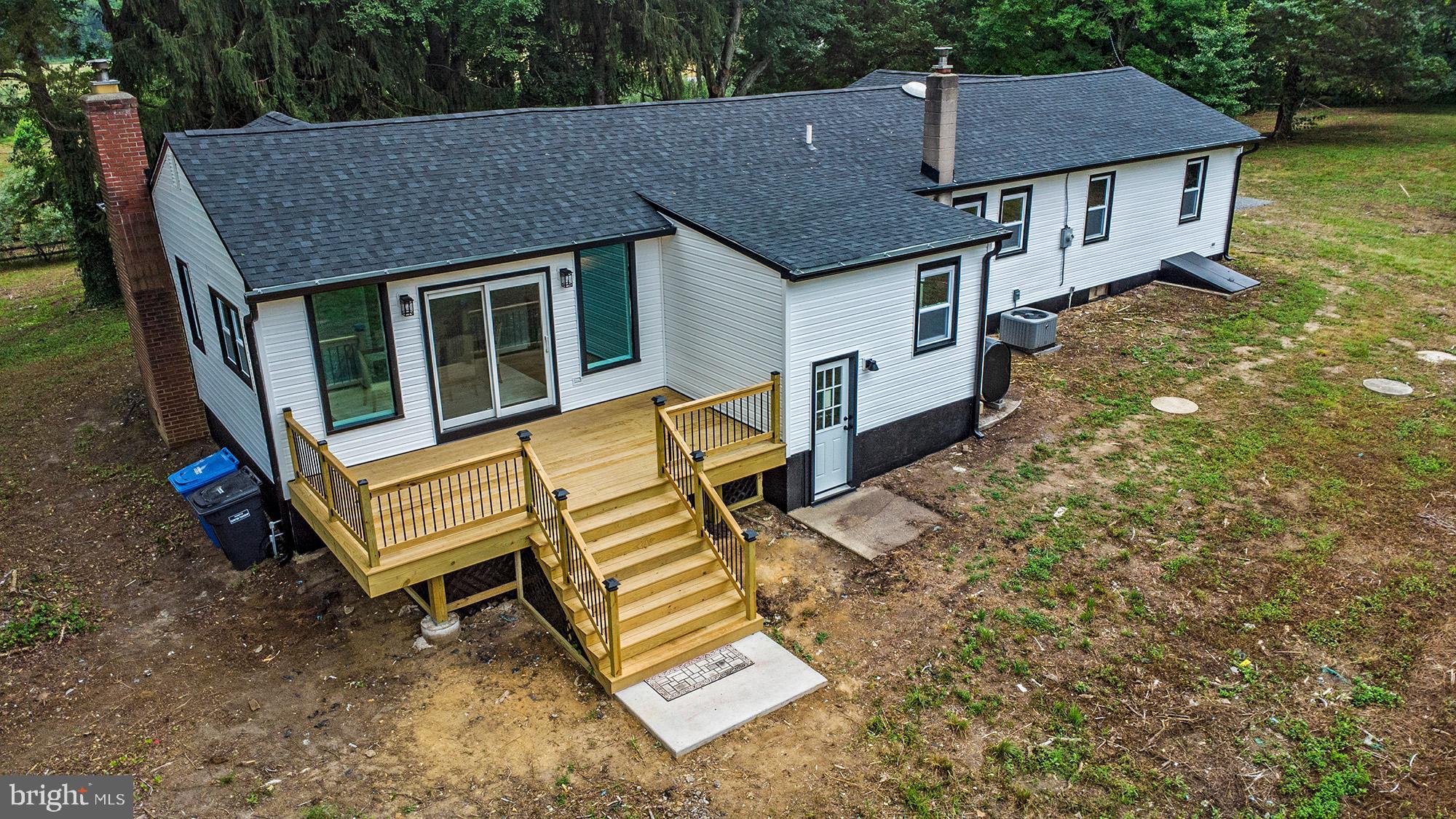 93 Jericho Road Salem, NJ 08079 - Photo 26 of 33 a aerial view of a house with a yard and wooden deck