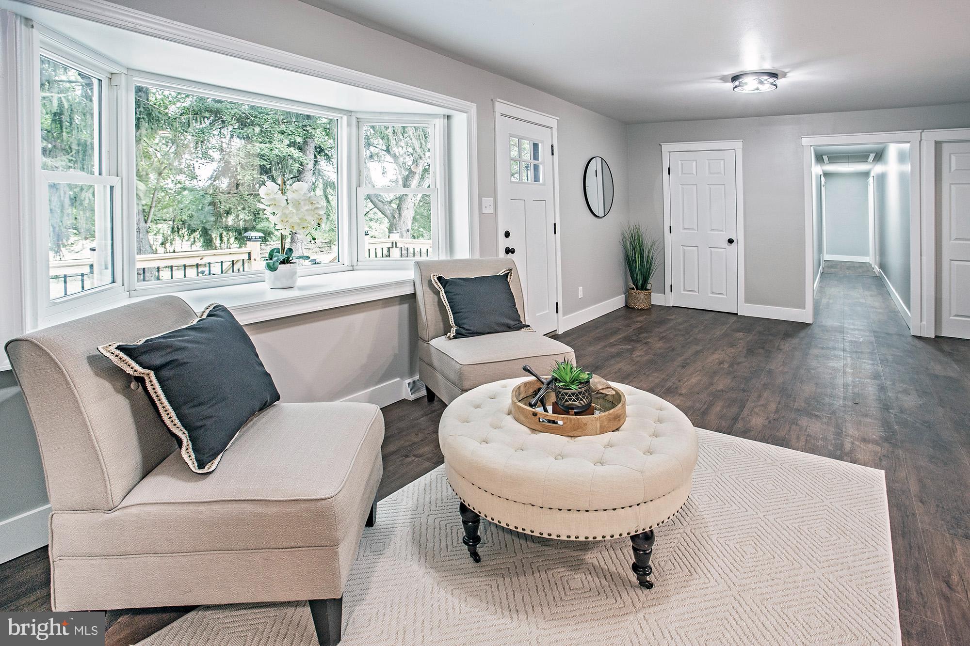 93 Jericho Road Salem, NJ 08079 - Photo 4 of 33 a living room with furniture and a large window