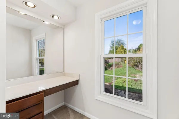 a view of room with window and front door