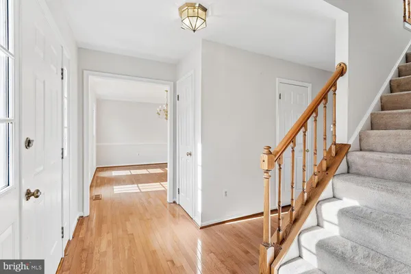 a view of an entryway with wooden floor